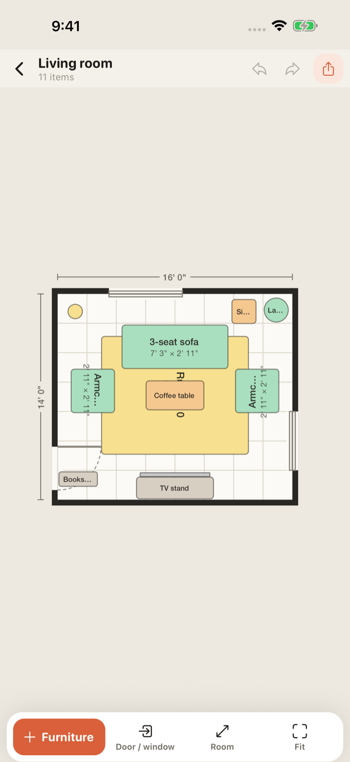 Snug editor showing a 16 by 14 foot living room with a sofa, armchairs, coffee table and rug